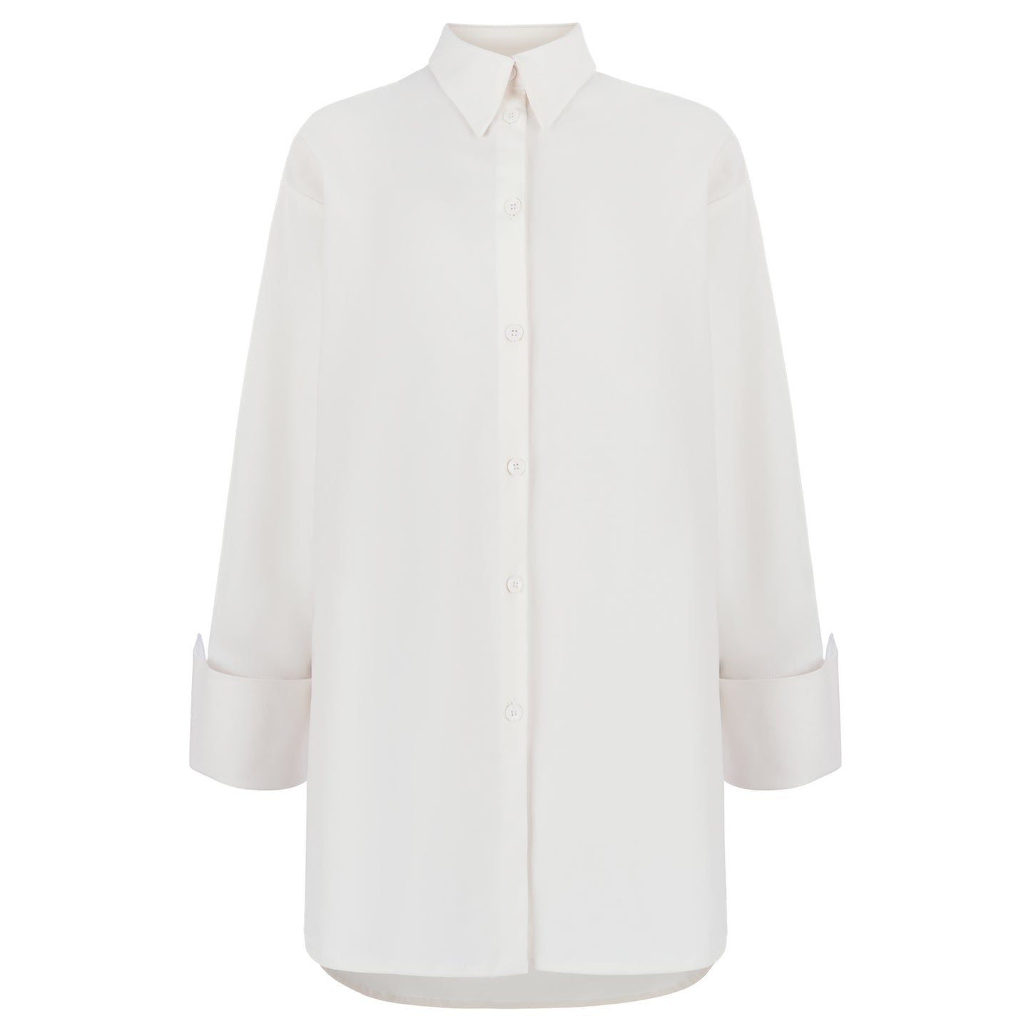 Close-up of a folded sleeve cuff on a white oversized shirt, showcasing the clean, tailored look and button closure detail.