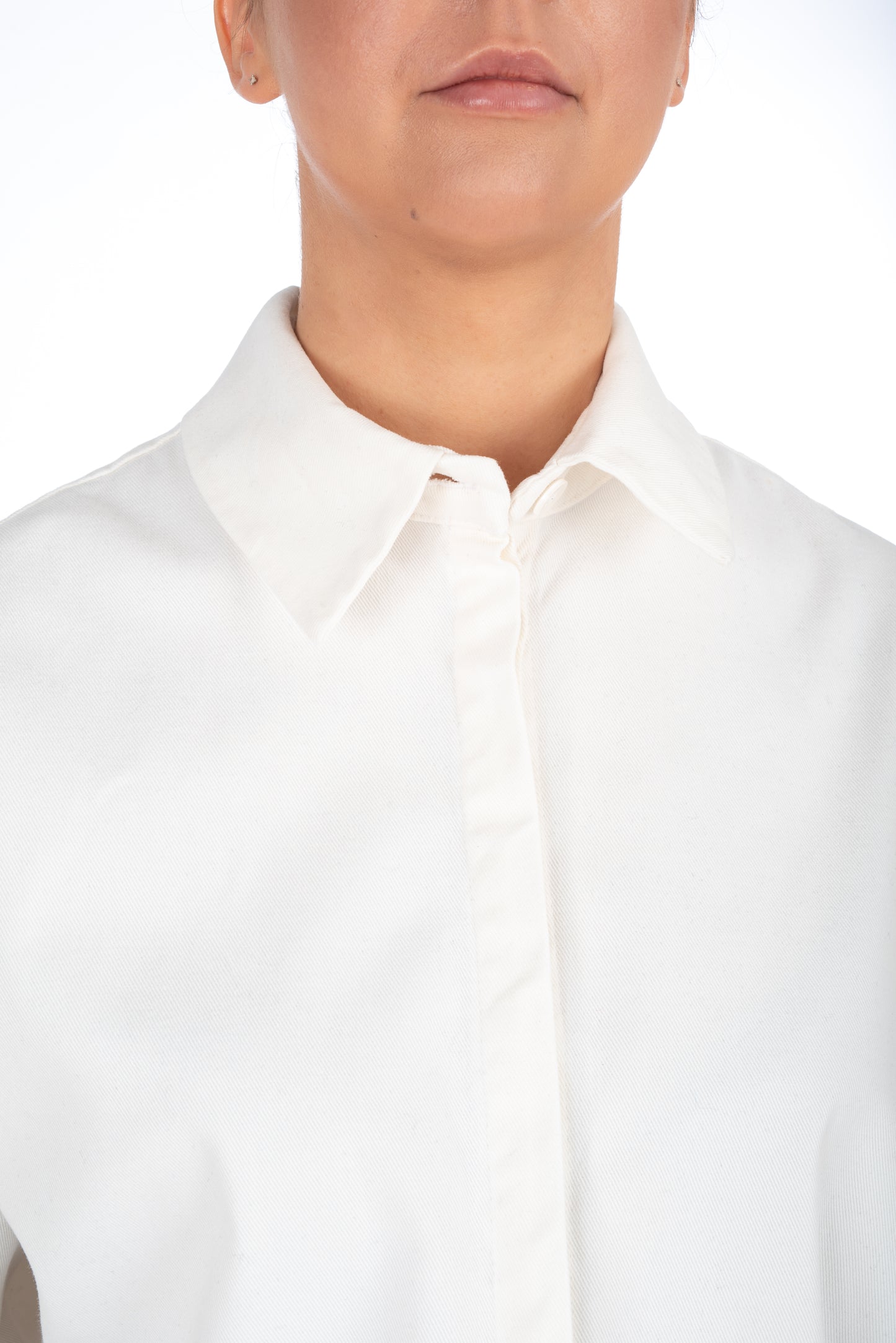 Close-up of a shirt's hidden placket, showing how the buttons are concealed under an additional fabric layer for a sleek, uninterrupted front design.